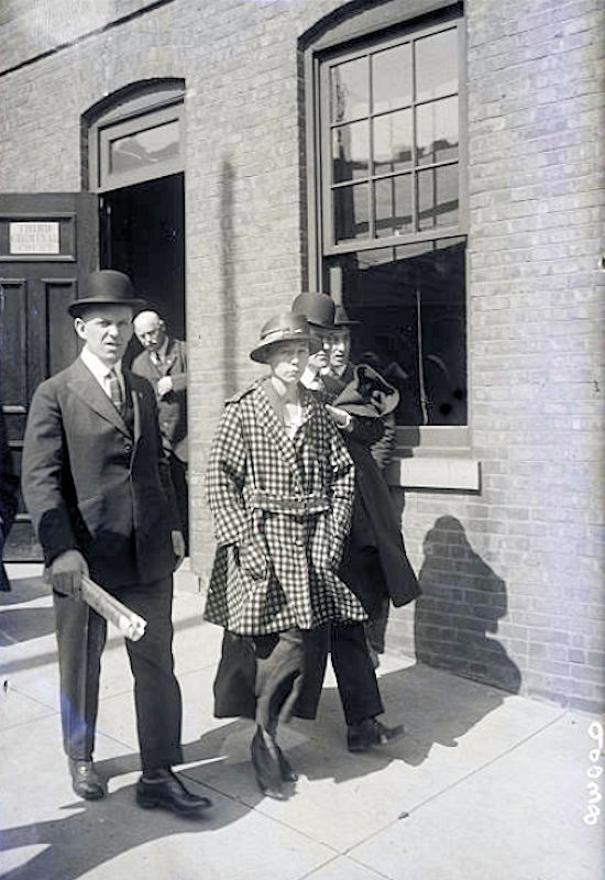 Mrs. Cora Hanglin
Mrs. Cora Hanglin, in custody of detectives on her way to be arrainged for manslaughter in the Second Criminal Court, Newark, NJ. The woman admits having buried a baby under the cement floor of her house at 54 Howard Street, Newark, NJ. 1919
Photo from Bettmann
